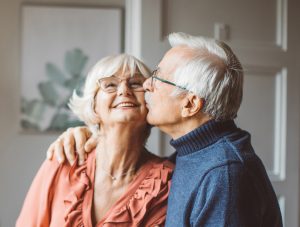 The Courtyard at Sussex Senior couple showing happiness over their new senior living apartment.