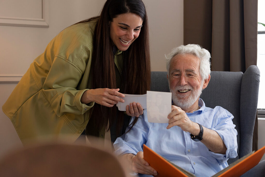 Adult daughter looking at photos with her dad